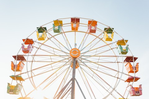colorful ferris wheel against blue sky