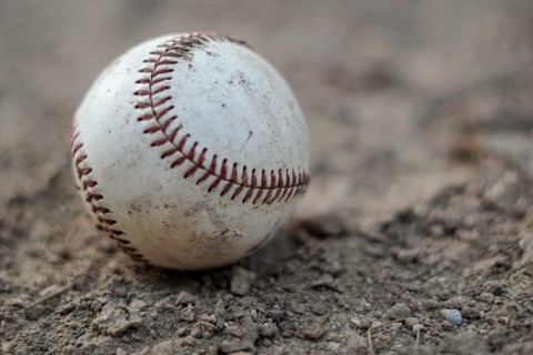 Baseball resting in the dirt