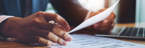 Hands holding a resume.