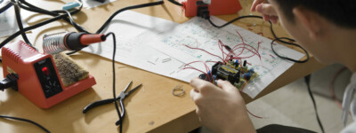 student building an electronic device