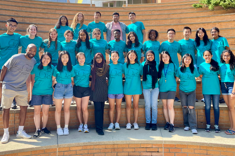 The F. POP students pose together in matching blue shirts.