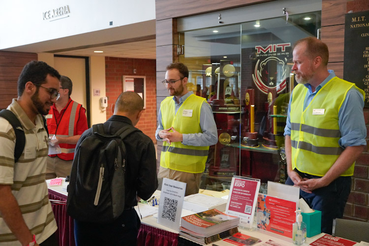 MIT Career Advising and Professional Development staff helping students at the fall career fair-fcf