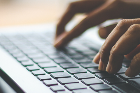 someone typing on a keyboard