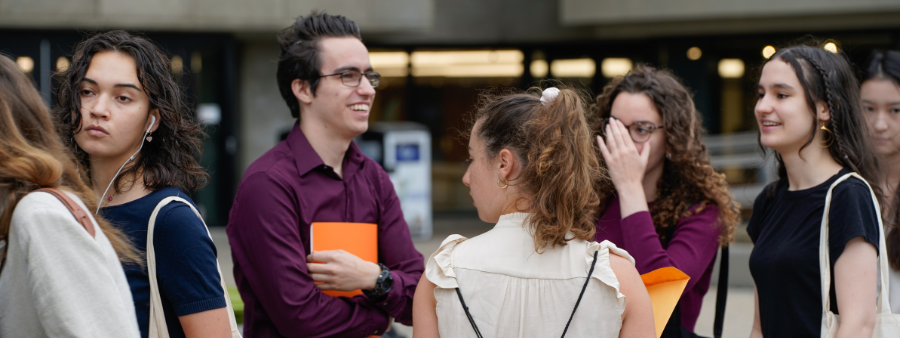 students standing in line for the career fair and chatting