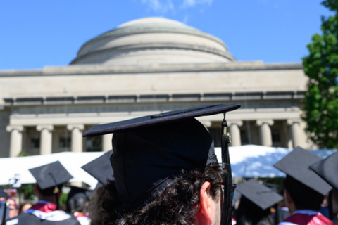 MIT's Great Dome with graduates on Killian Court on the Cambridge campus, representing the Institute's No. 1 ranking in the 2026–27 QS World University Rankings.