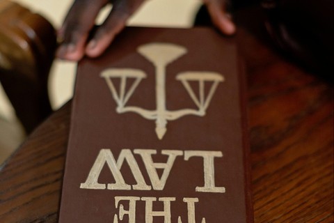 A leather-bound book that says