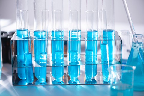 Beakers side by side filled with blue liquid