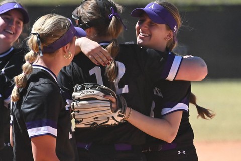 Dylan and teammates hug after game