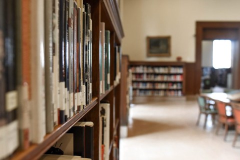 Bookshelves full of books in a library.