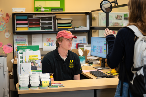 Student walks up to the front desk at Mohr Career Services asking for support