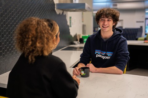 Two students meet for coffee