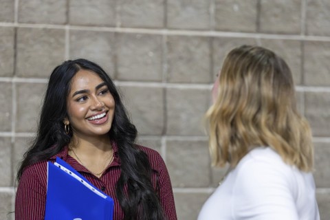 Student smiling at employer