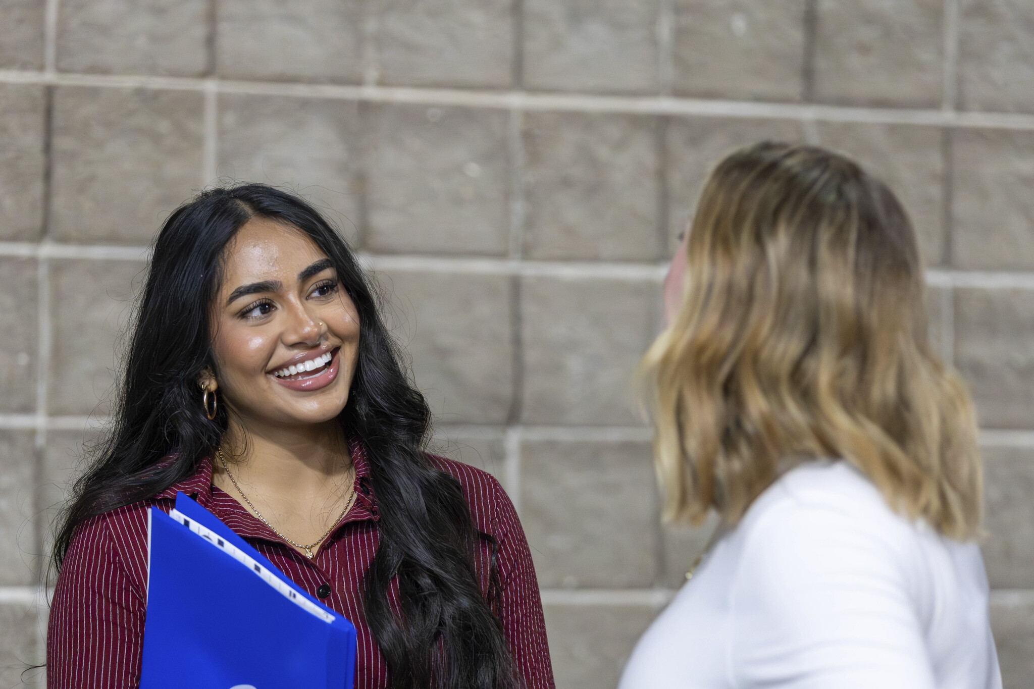Student smiling at employer