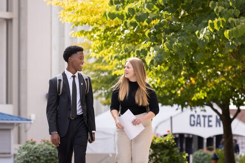 Two students walking by the Dome