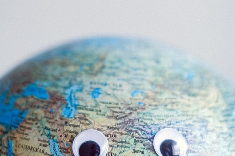 Globe with googly eyes
