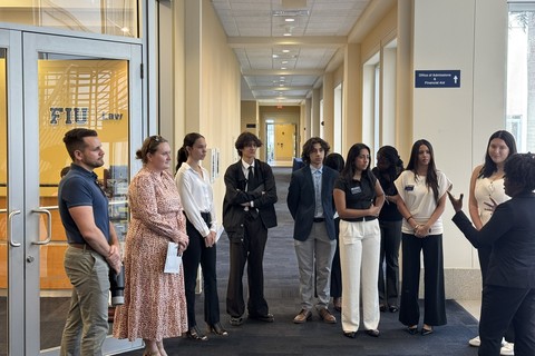 Students gather as part of a campus tour of FIU College of Law