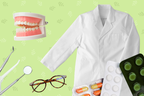 Various medical and dental tools laid out over a green background.