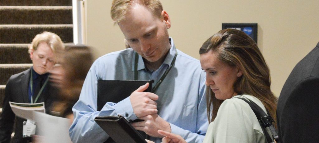 Student connects with employer at the career fair. 