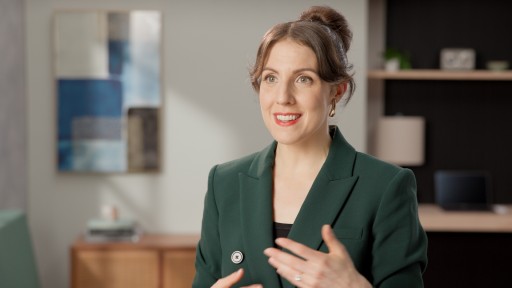 picture of a Professional women presenting information.