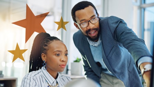 Two co-workers reviewing information