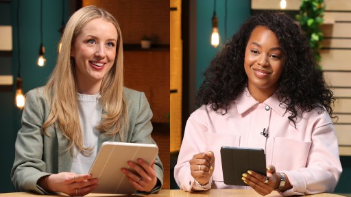 Two women in a meeting with ipads.