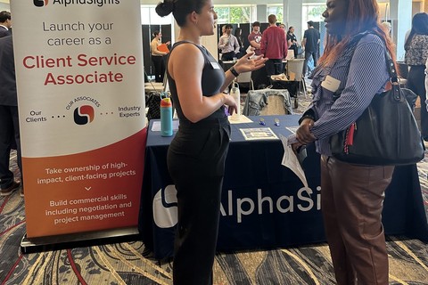 2025 Consulting Internship Exploration Fair attendee talking with recruiter from AlphaSights