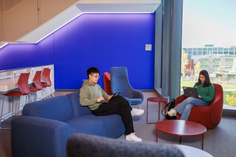 Students at the Cornell Ann S. Bowers College of Computing and Information Science Building