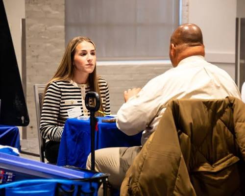 Student interviewing with an employer at the career fair