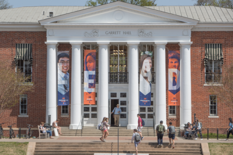 the ourside of Garrett Hall, with banners hung. The banners read LEAD.