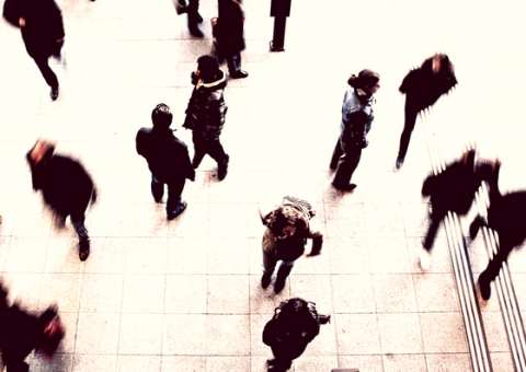 an overhead view of people walking in an urban setting