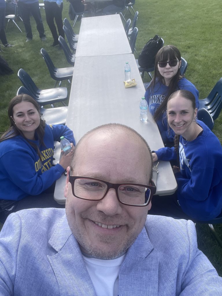 Kevin Fullerton and 3 LeadState students taking a selfie together