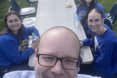 Kevin Fullerton, the chair of Leadstate, taking a selfie with 2 LeadState students