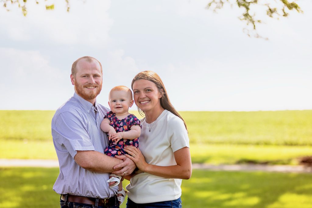 Brandon Berg ('21); wife Anna ('21 Exercise Science; '22 Masters in Athletic Training) and daughter Ruth