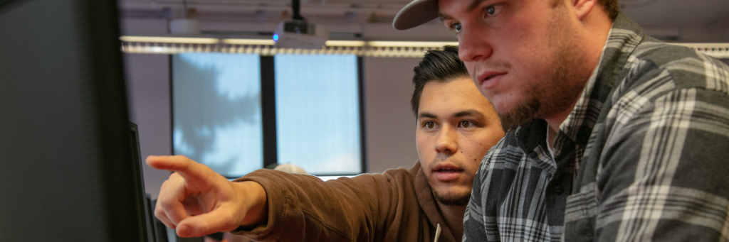 Students working in front of a monitor