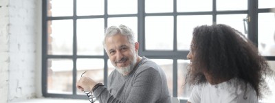 Man and young girl working together in the workplace
