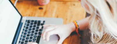 Woman typing on a laptop
