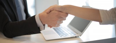 close up of two people shaking hands