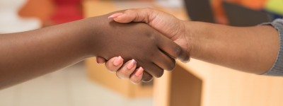 close up of two people shaking hands