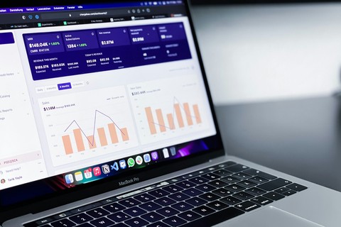 laptop with charts and graphs