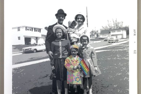 Artwork of family in black and white with young child holding rainbow flag, by Rich Harrington