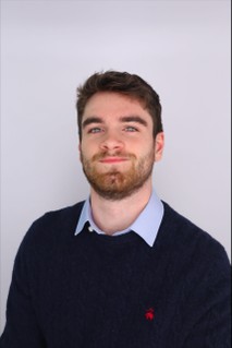 A photo of Dave Bellante. A man with dark hair and a beard, smiling.