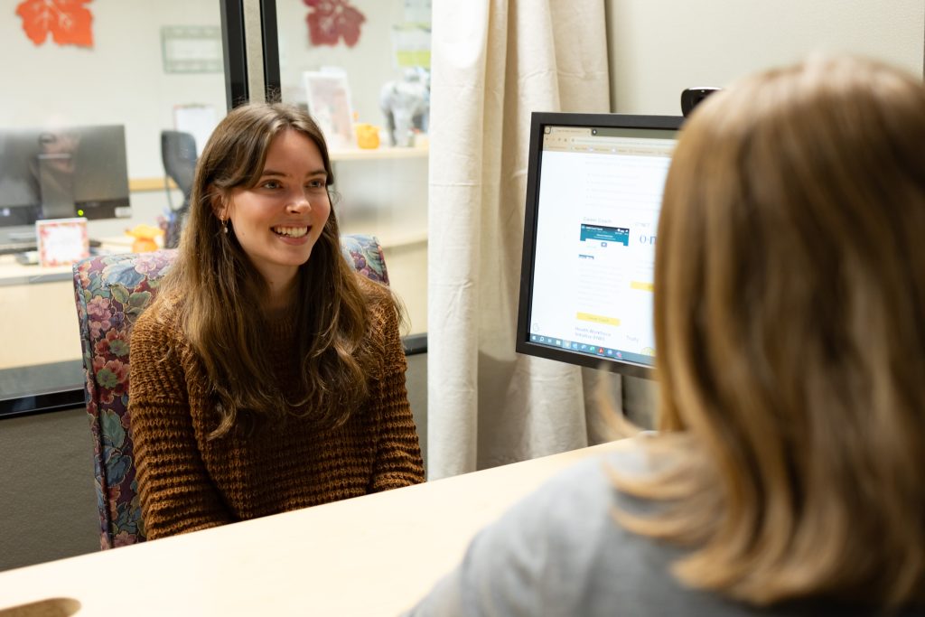 student speaking with career counselor