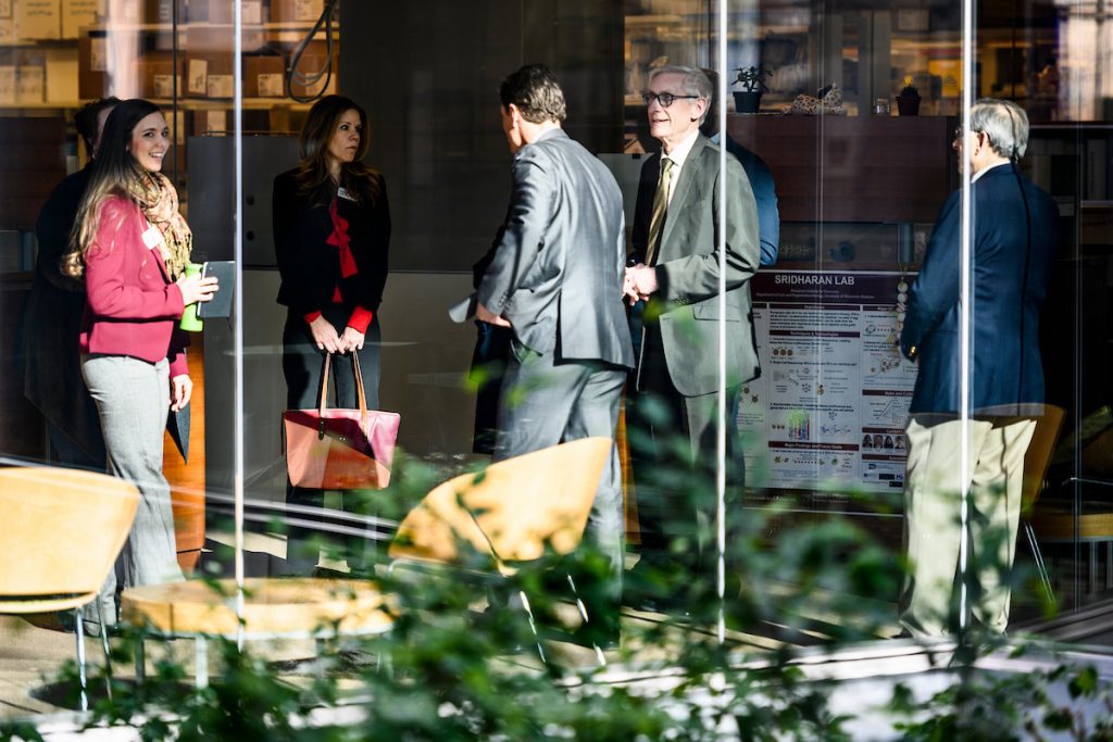Wisconsin Gov. Tony Evers, second from right, meets with faculty, staff and student researchers in the Wisconsin Institute for Discovery during Evers's tour of the Discovery Building at the University of Wisconsin-Madison on March 5, 2019. (Photo by Jeff Miller / UW-Madison)