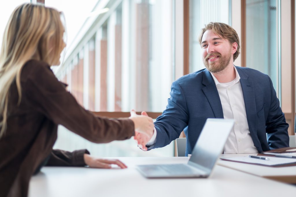 Two people shaking hands.