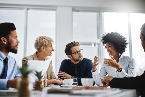 Businesspeople sitting together in a meeting.