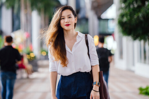 Closeup of a person walking on a sidewalk.