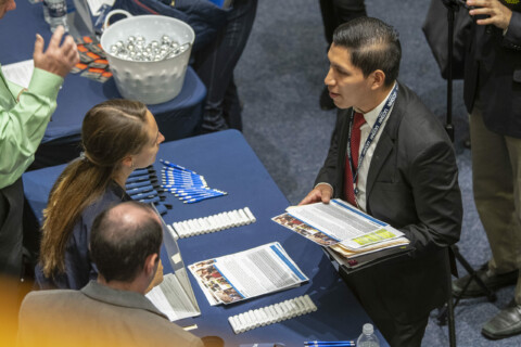 Photo of student talking with employer at a UConn Career Fair