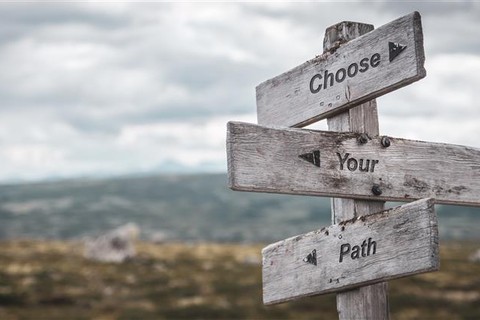 Three trail markers; the top reading