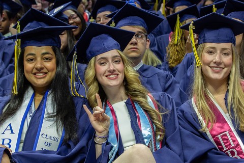 2025 UConn graduates in Gampel Pavilion during the College of Liberal Arts and Sciences commencement ceremony.