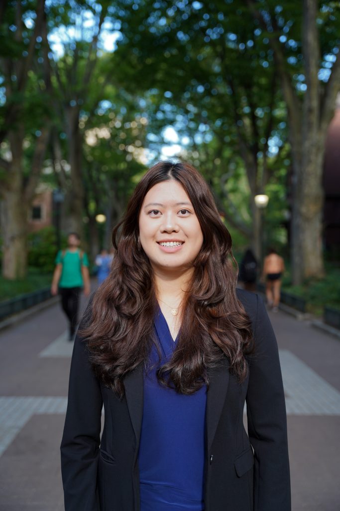 Jean smiling in a blue blouse and black blazer on Locust Walk